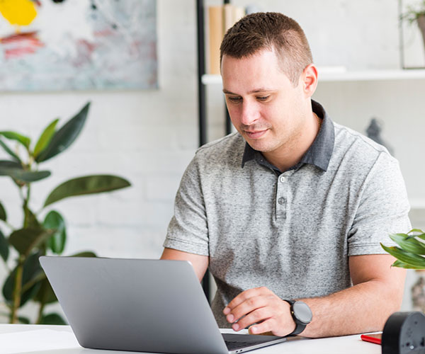 man using laptop for online session